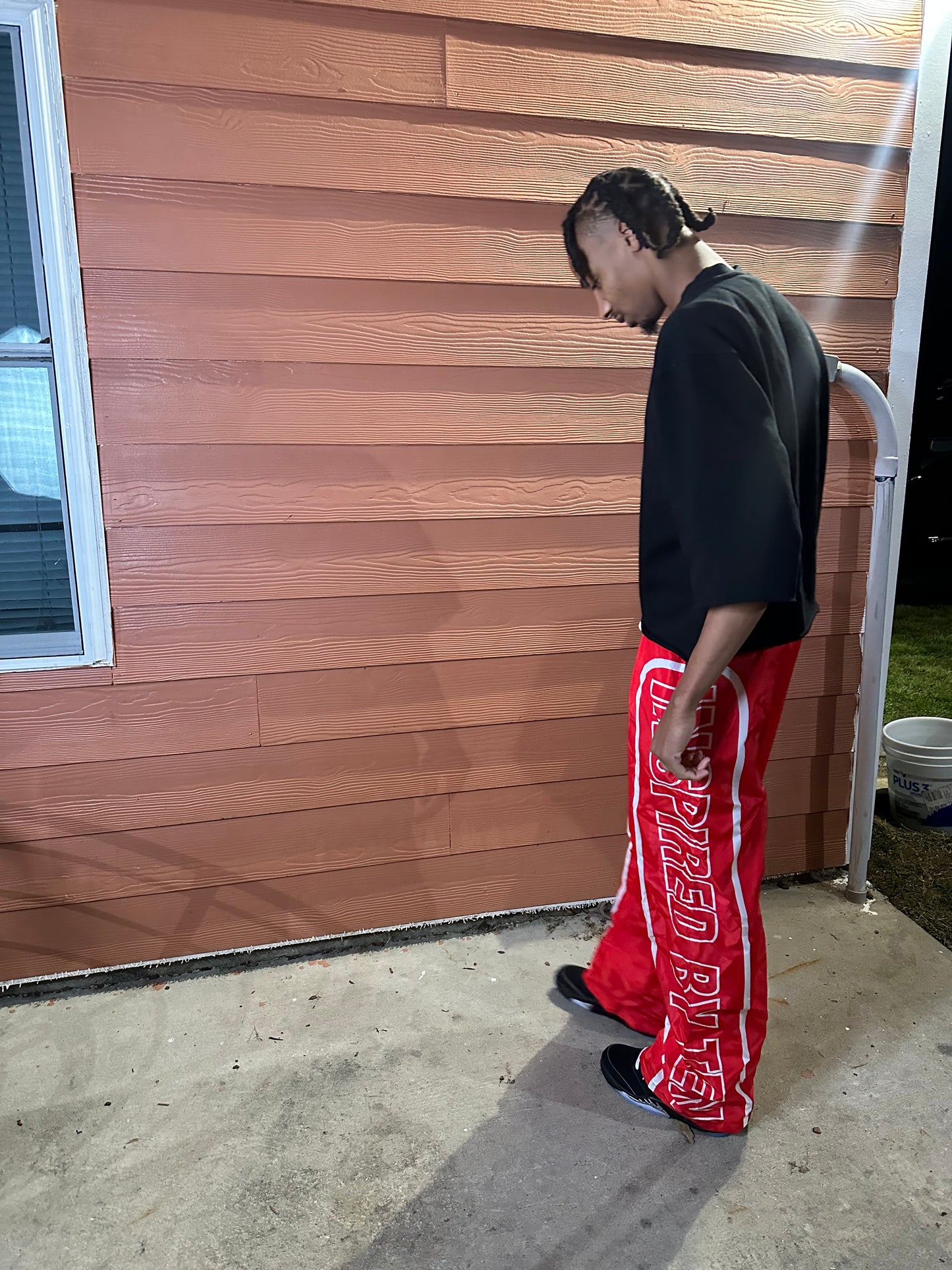 INSPIRED BY TEN RED TRACK PANTS