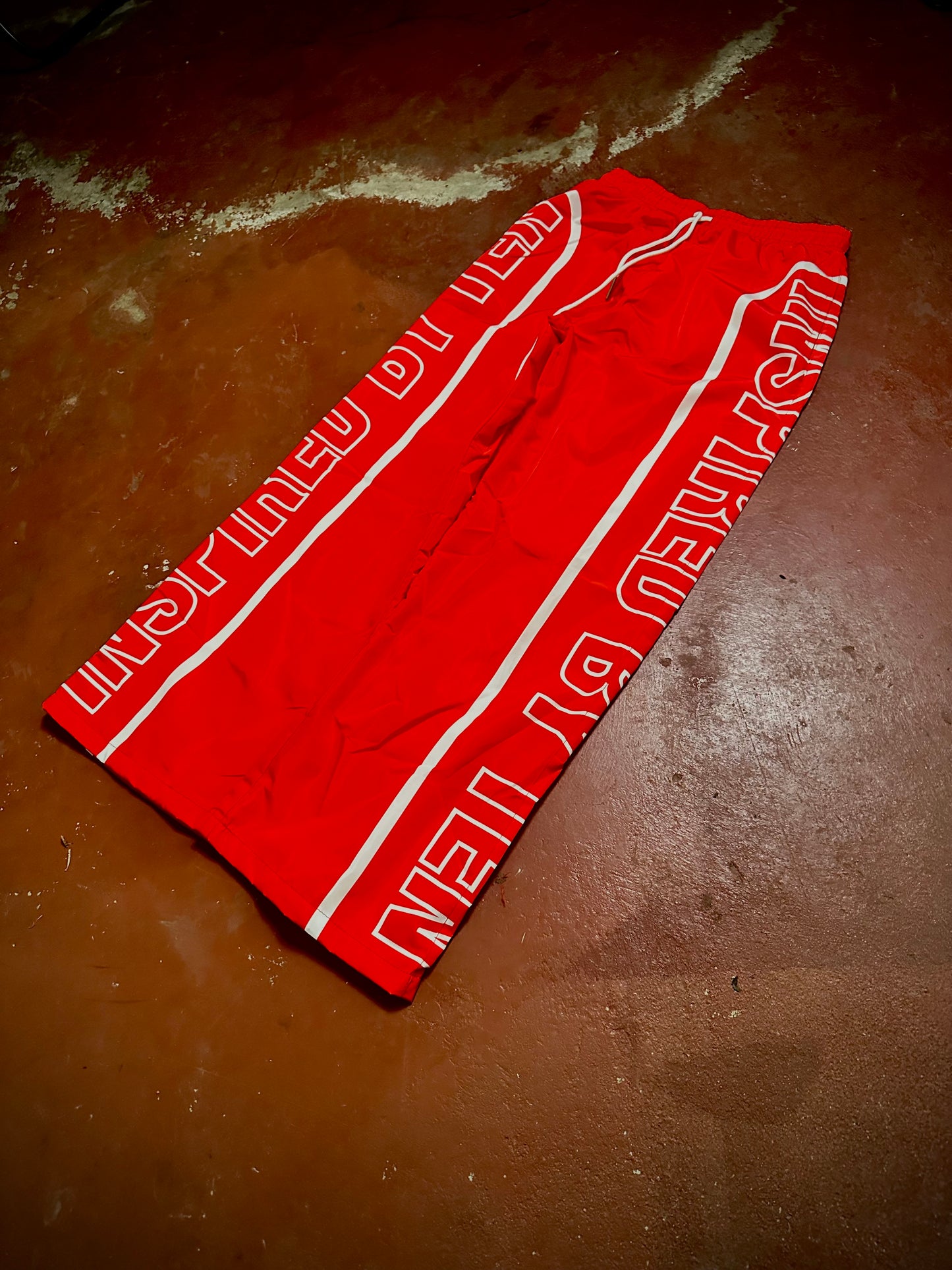 INSPIRED BY TEN RED TRACK PANTS